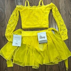 Brand new yellow, two piece costume from The Line Up. child size 8.